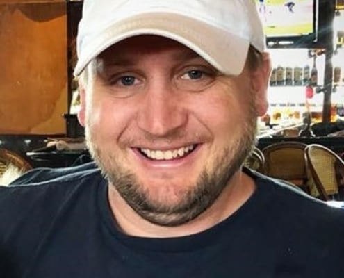 Nolan, founder and Certified Master Inspector at Panoptic Inspections, smiling in a white cap